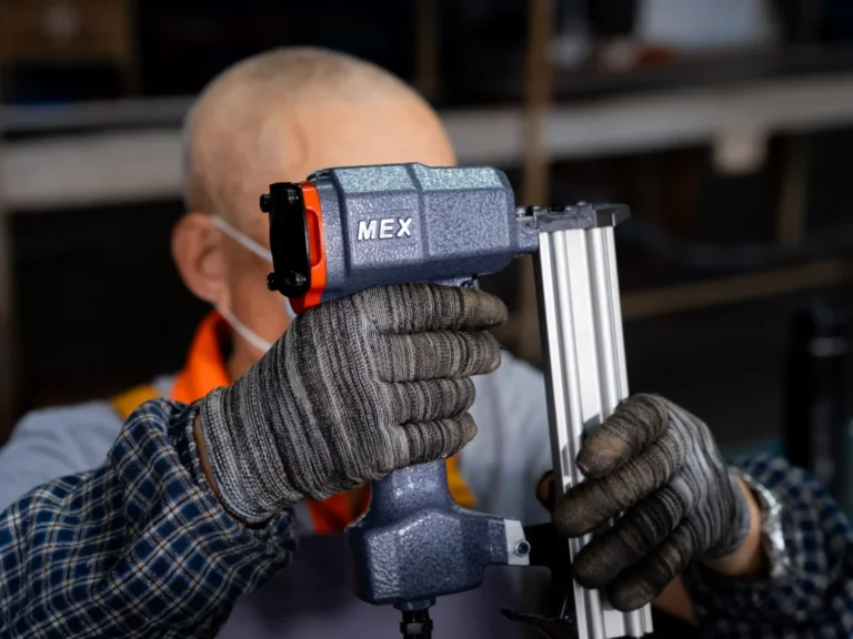 MEX employee examining product surface